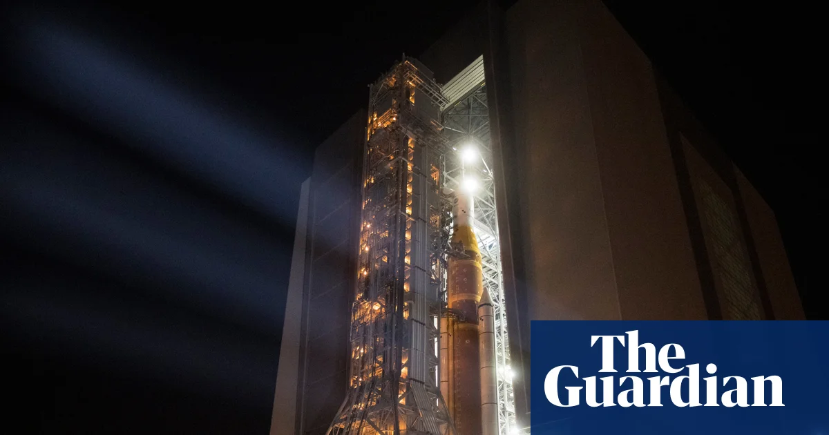 Nasa’s Artemis II rocket begins slow crawl to launchpad in preparation for moon fly-by | Nasa