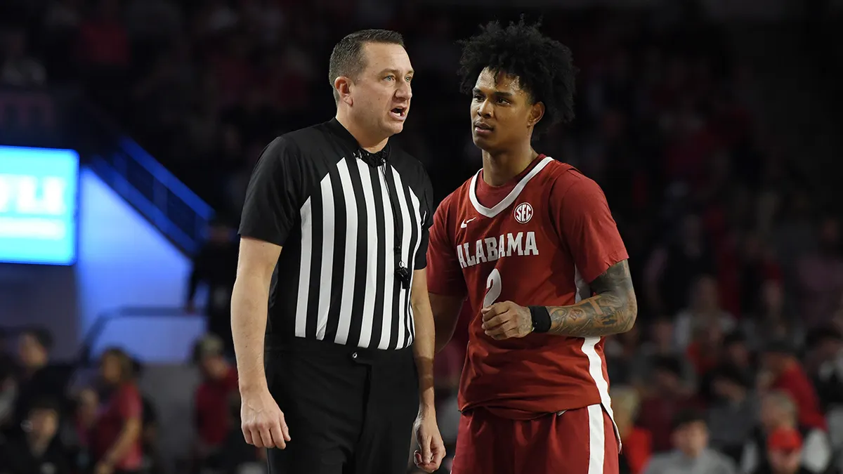 Aden Holloway speaks to official