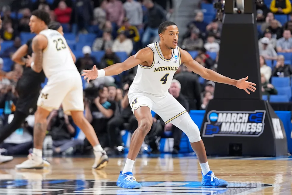 Mar 19, 2026; Buffalo, NY, USA; Michigan Wolverines guard Nimari Burnett (4) defends against the Howard Bison during a first round game of the men's 2026 NCAA Tournament at Keybank Center. Mandatory Credit: Gregory Fisher-Imagn Images