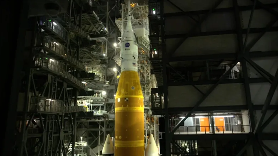 A camera inside the Vehicle Assembly Building looks on as the Space Launch System rocket began its 4-mile trip to the launch pad shortly after midnight. / Credit: NASA