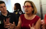Former Sen. Sinema Acknowledges ‘Romantic And Intimate’ Relationship With Married Bodyguard In Lawsuit By Ex-Wife