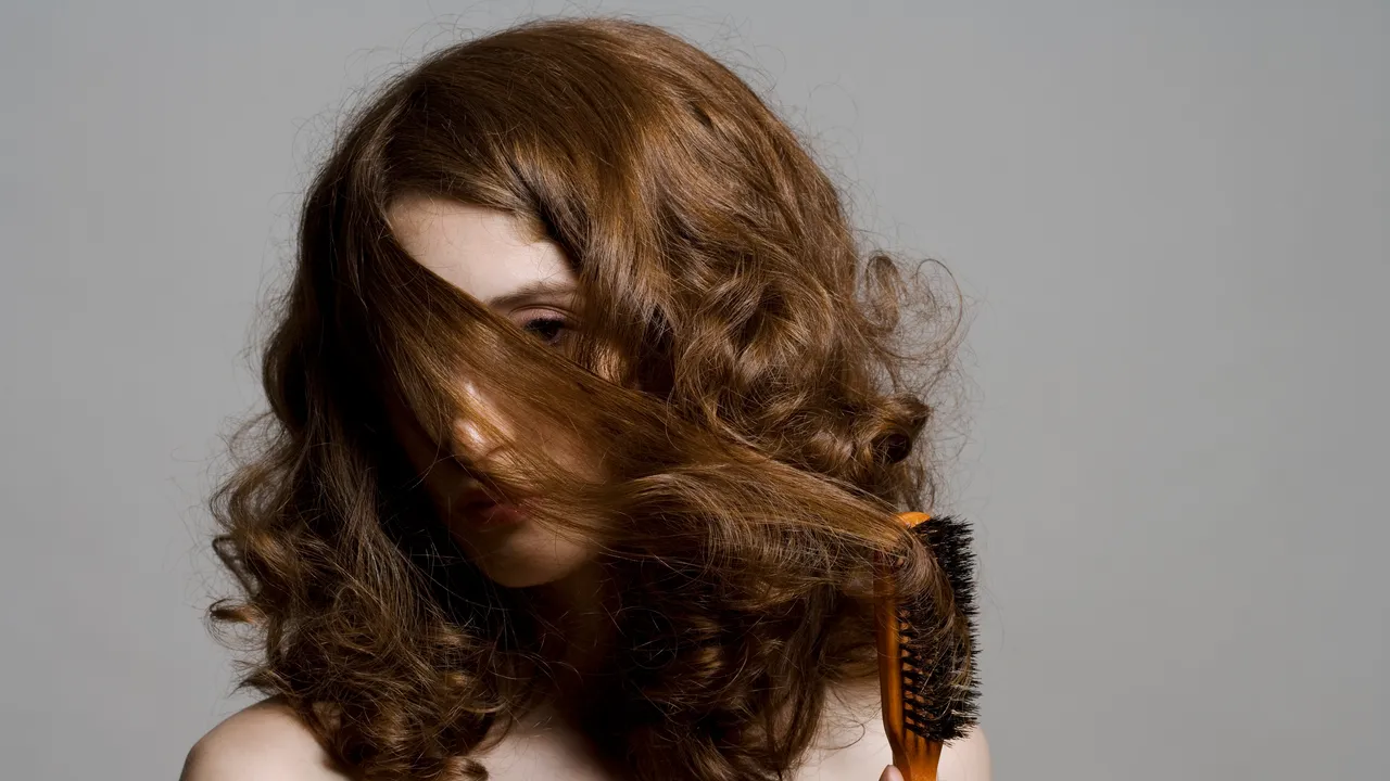 How to Straighten Curly Hair Safely, According to Experts