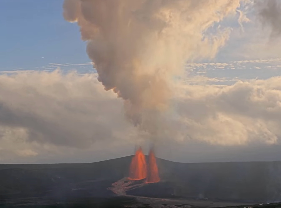 View from Halemaʻumaʻu crater, with two plumes of lava and a large cloud rising from the crater