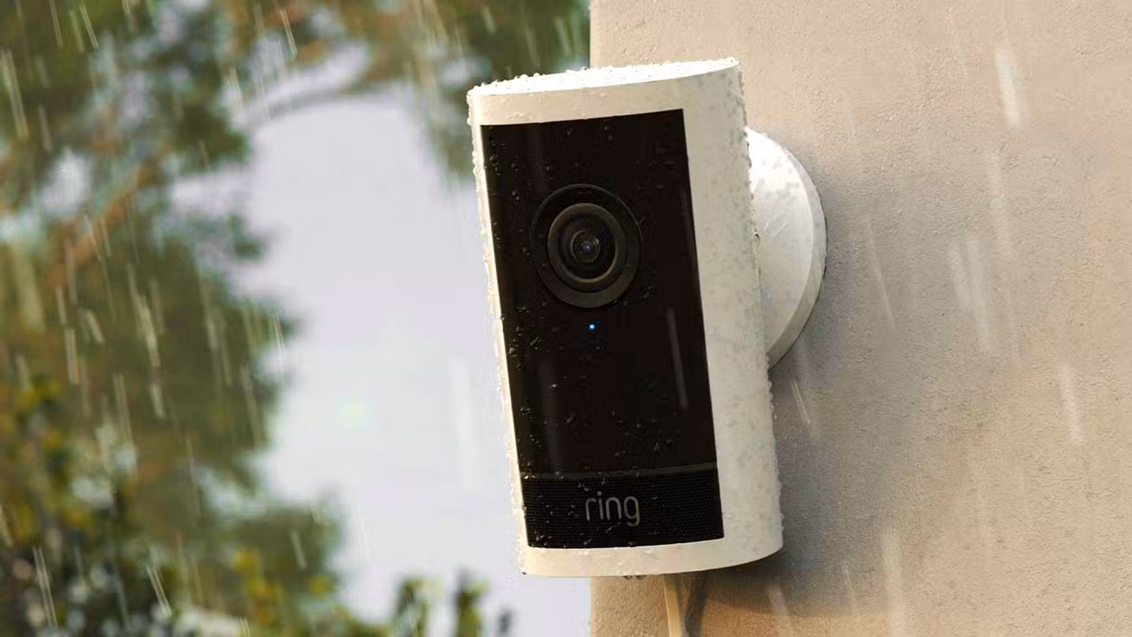 A Ring Pro camera in the rain on the side of a building.