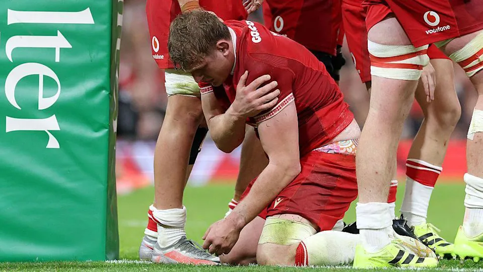 Jac Morgan holds his shoulder after getting injured scoring for Wales against Argentina