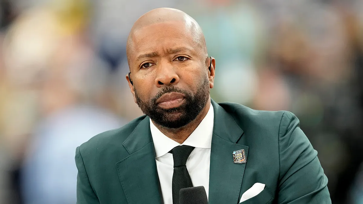 Kenny Smith on a television set