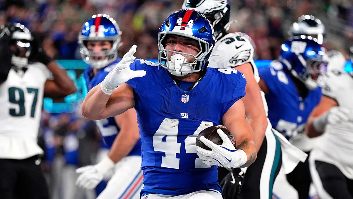 Cam Skattebo scores a touchdown