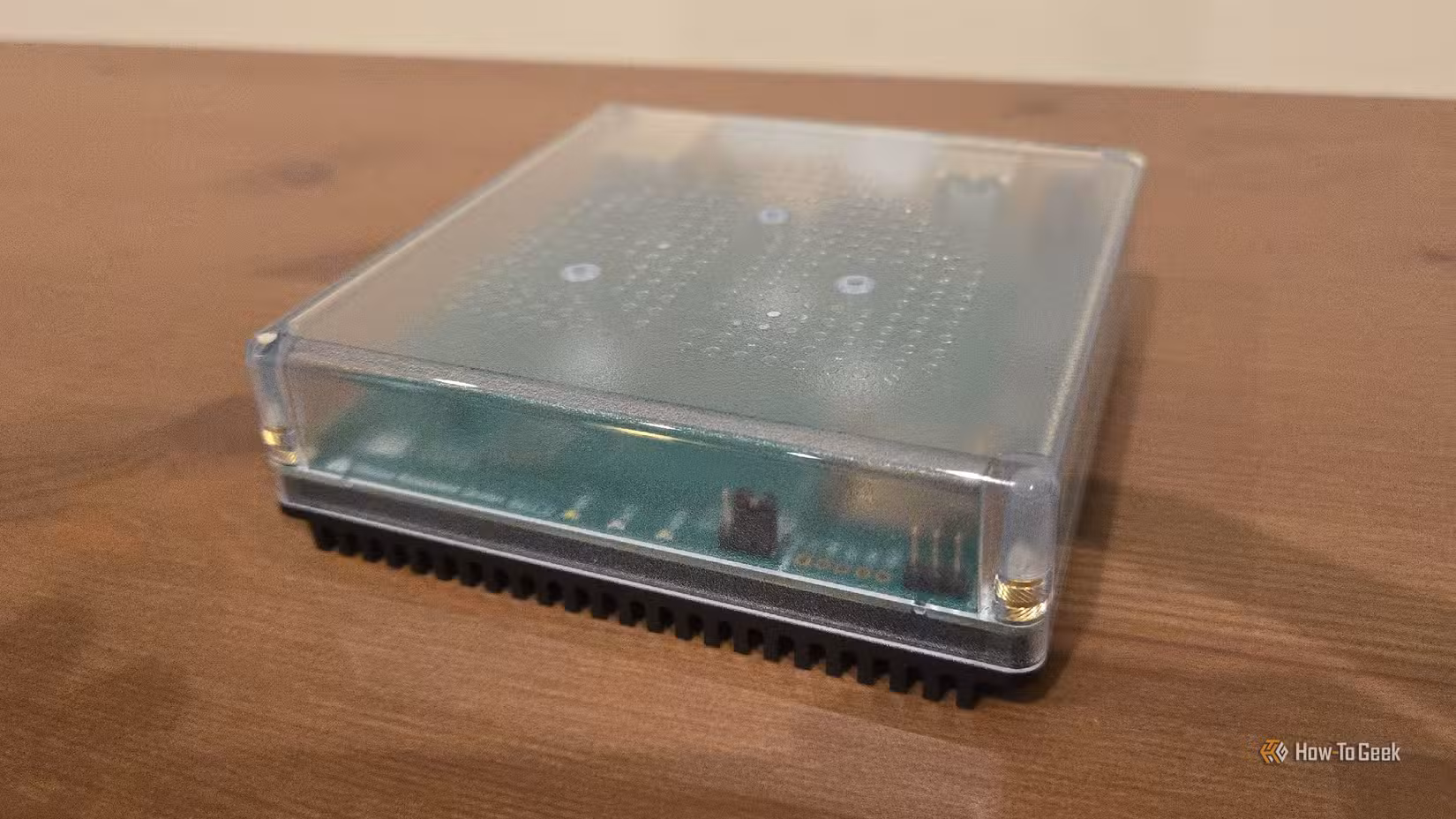 Home Assistant Green on an entertainment stand.