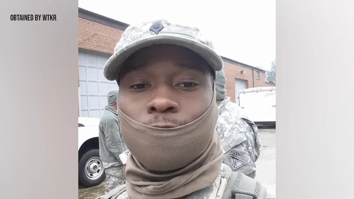 Mohamed Bailor Jalloh wearing face covering