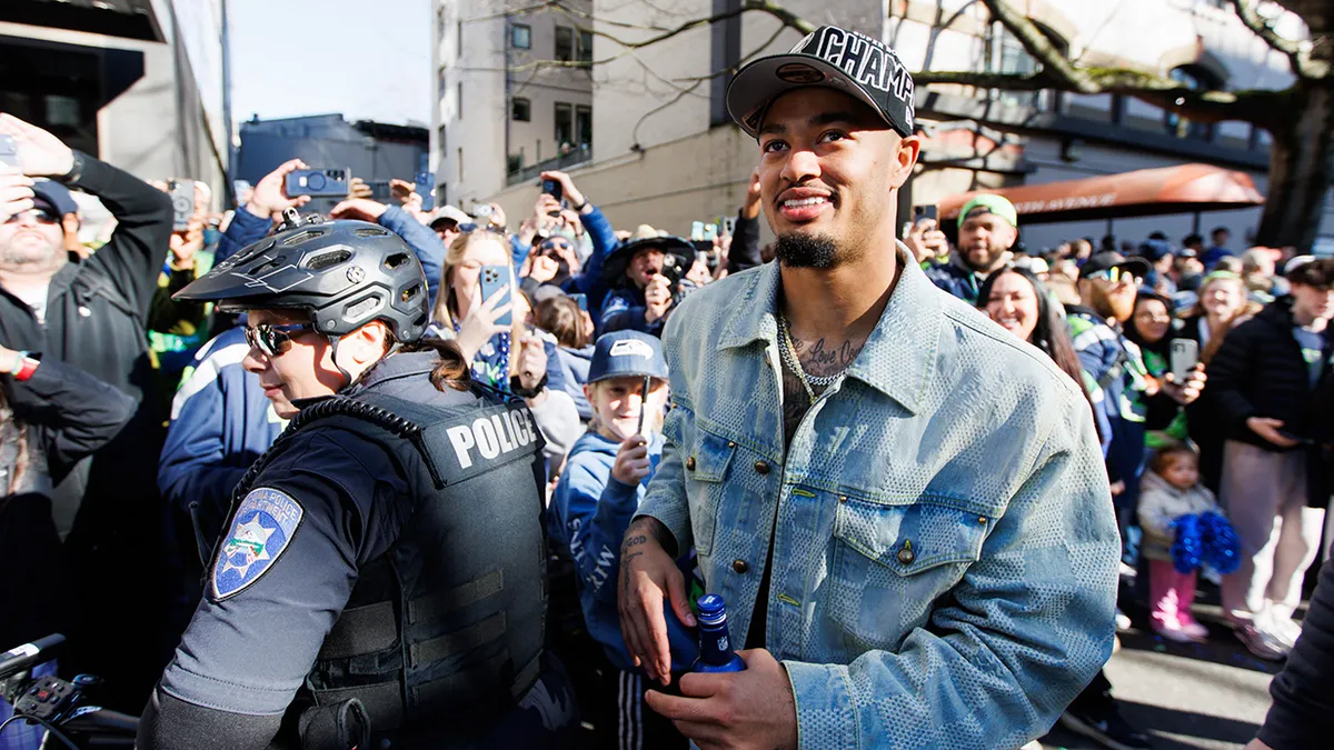 Jaxon Smith-Njigba celebrates a Super Bowl title