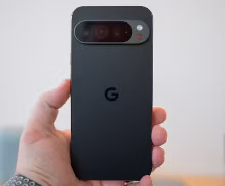 A person holding the Google Pixel 9 Pro smartphone. 