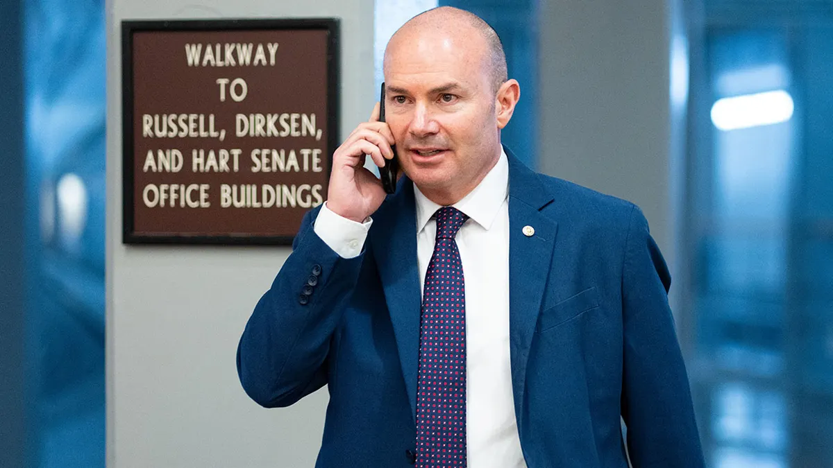 Sen. Mike Lee, R-Utah, walks through the Senate subway.