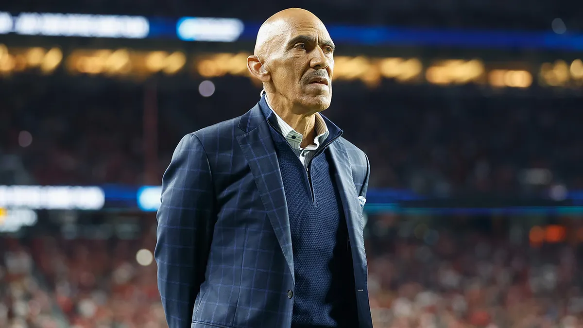 Tony Dungy looks on from the sideline