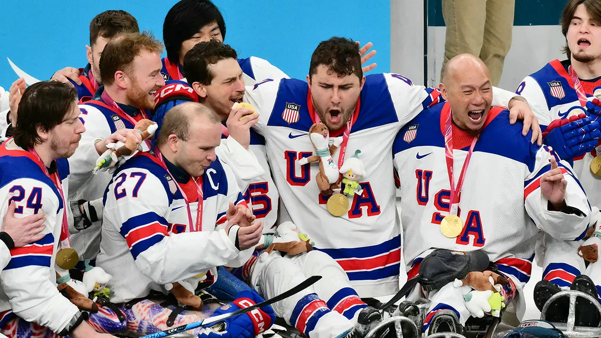 USA paralympic hockey players celebrate