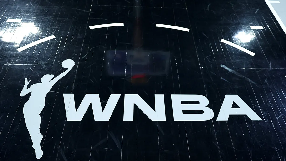 A WNBA logo is shown on the court