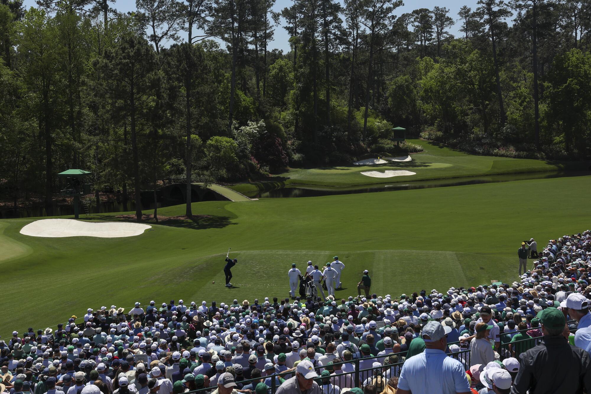 Rory McIlroy plays a shot from the 12th tee during the first round of the Masters on Thursday.