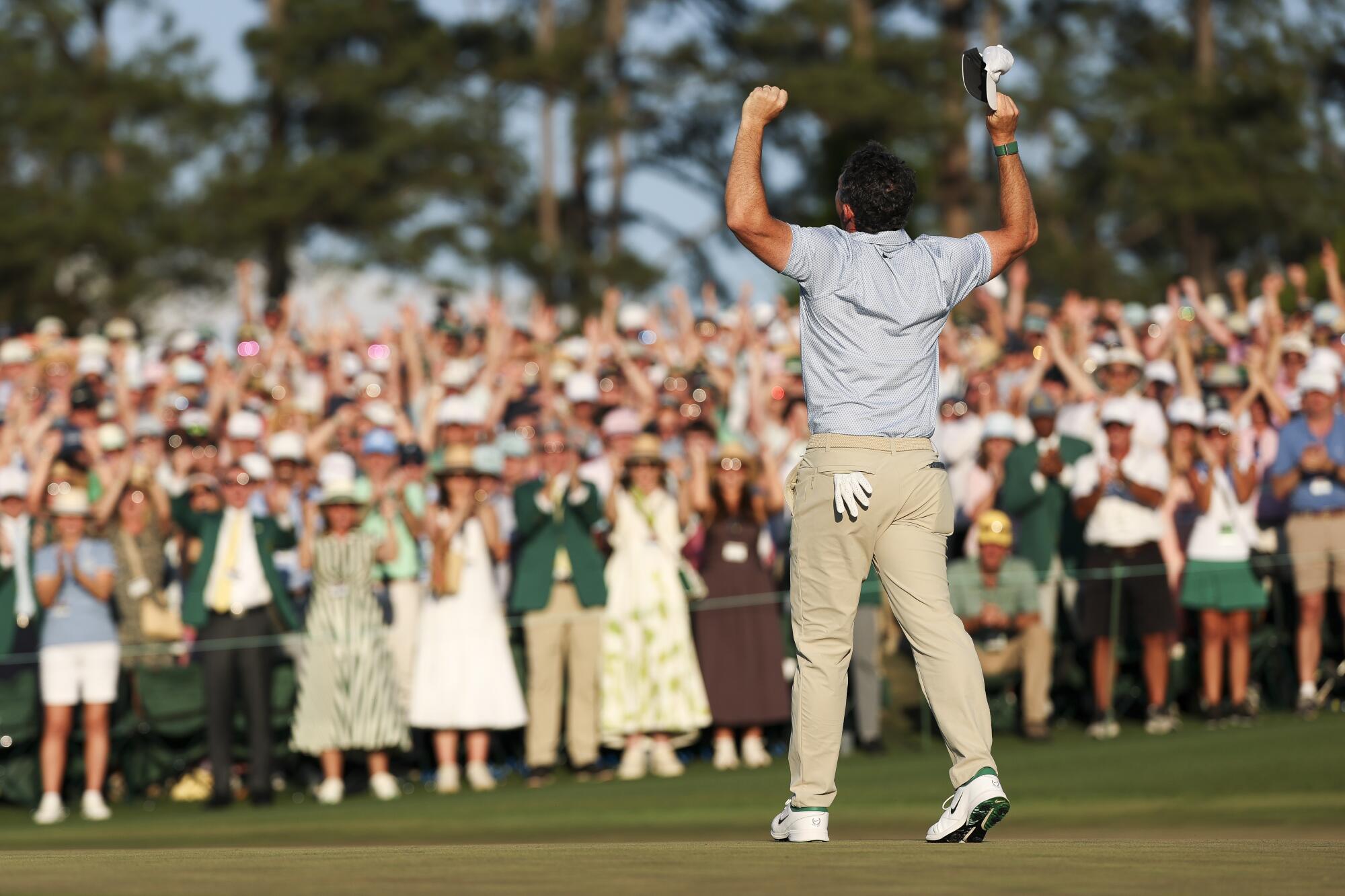 Rory McIlroy celebrates as crowd roars after he won the Masters at Augusta National Golf Club on Sunday.
