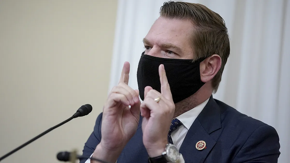 Rep. Eric Swalwell wearing a protective mask speaking during a House Intelligence Committee hearing in Washington, D.C.
