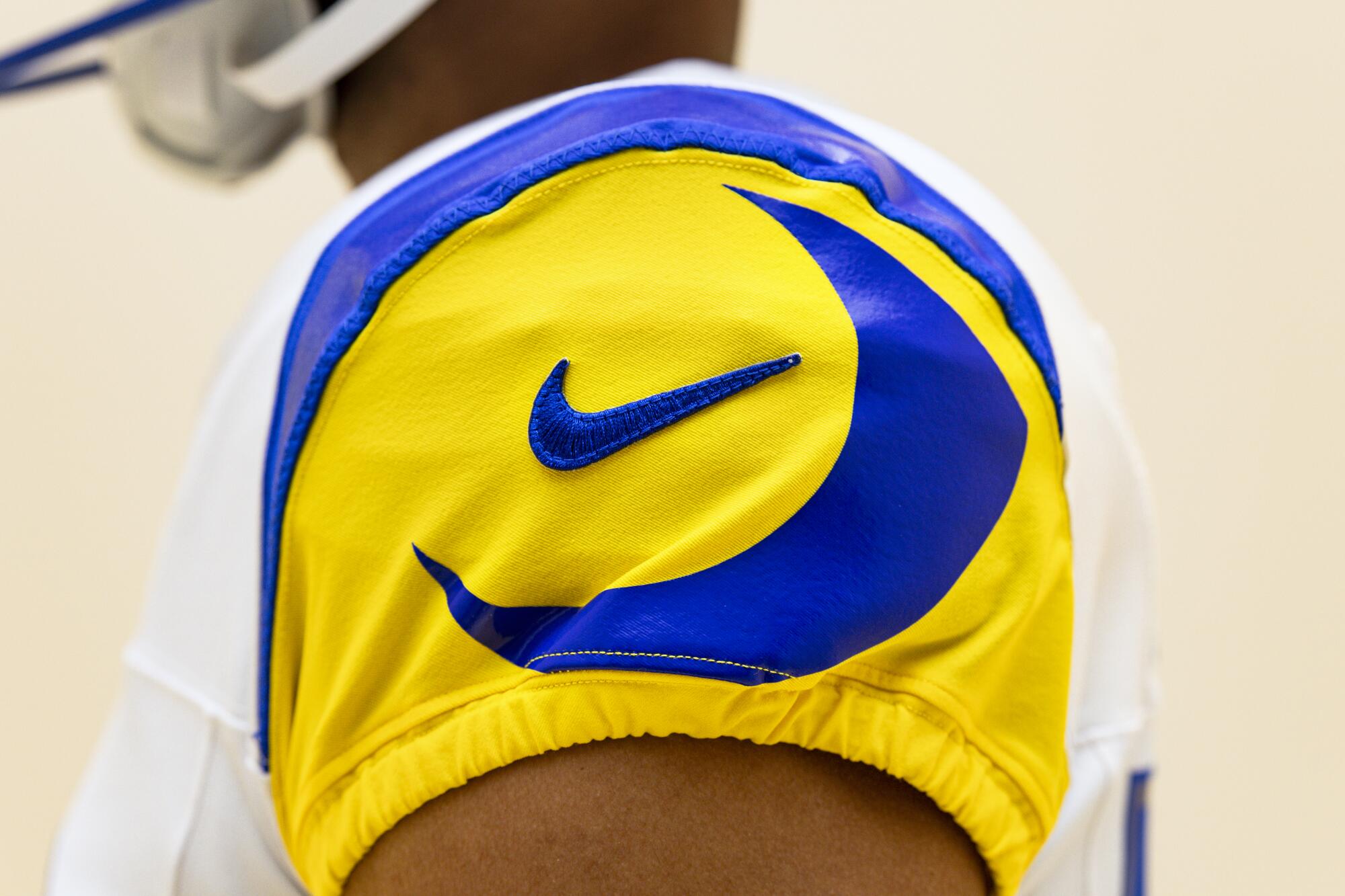 A detailed look at the Rams' new white uniform sleeve with blue and gold accents.