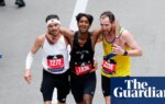 ‘Two are stronger than one’: Boston Marathon duo praised for helping struggling runner cross finish line | Boston Marathon