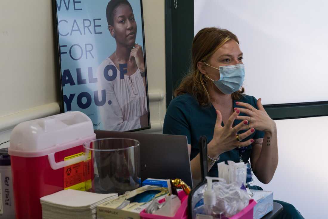Samantha Pohlman, a registered nurse, speaks with a patient prior to cosmetic treatment at Planned Parenthood -in Sacramento, Calif.