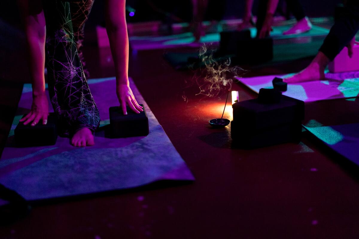 Students take part in a Goth Yoga class.