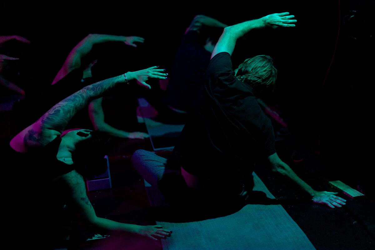 Students take part in a Goth Yoga class.