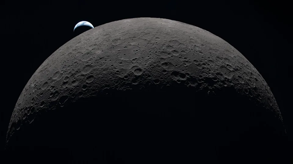 photo from a spacecraft showing a tiny crescent earth hovering above a giant-looking moon