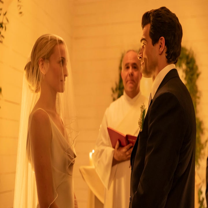 Bride and groom exchange vows at an intimate indoor wedding ceremony with an officiant
