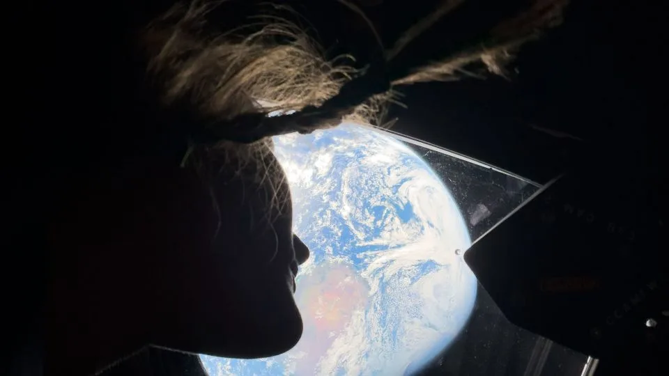 NASA astronaut Christina Koch looks back on Earth. - NASA