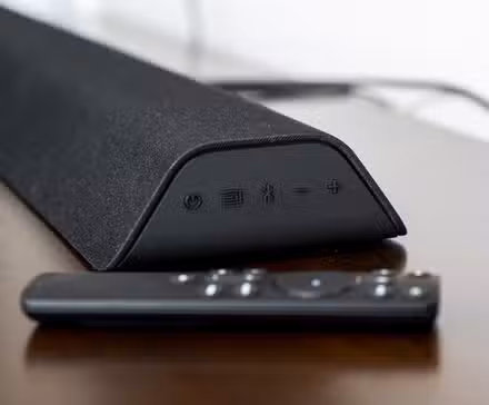 The Vizio V21D-J8 soundbar on a TV table.