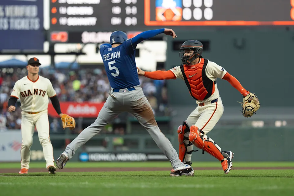 Apr 22, 2026; San Francisco, California, USA; Los Angeles Dodgers first baseman Freddie Freeman (5) gets tagged out by San Francisco Giants catcher Patrick Bailey (14) at Oracle Park. Mandatory Credit: Stan Szeto-Imagn Images