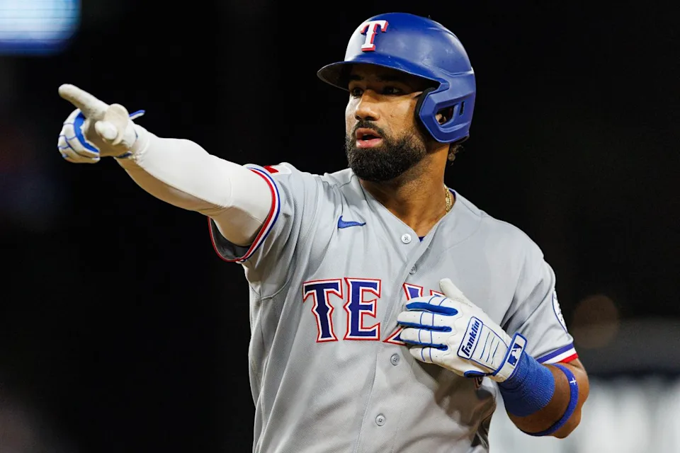 Ezequiel Durán #20 of the Texas Rangers celebrates after hitting a single during an MLB game against the Los Angeles Dodgers at Dodger Stadium on April 10, 2026 in Los Angeles, California.
