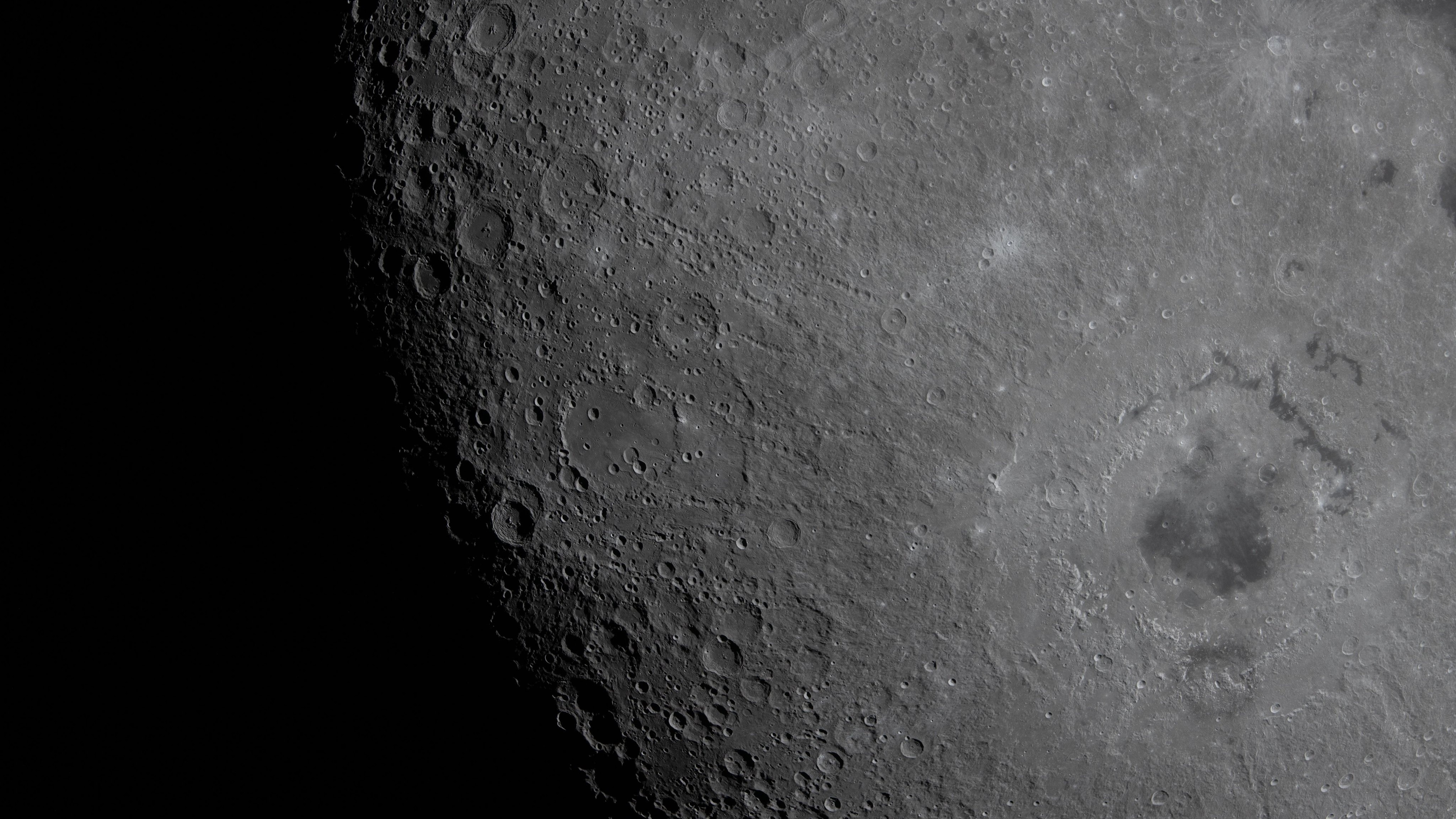 Carroll and Integrity crater are among the many seen on the moon's face.