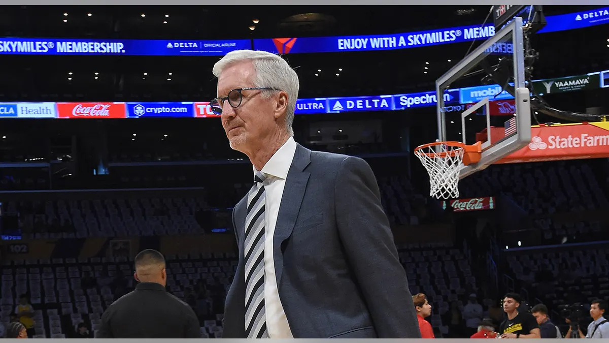 Mike Breen walking on court at Crypto.com Arena in Los Angeles