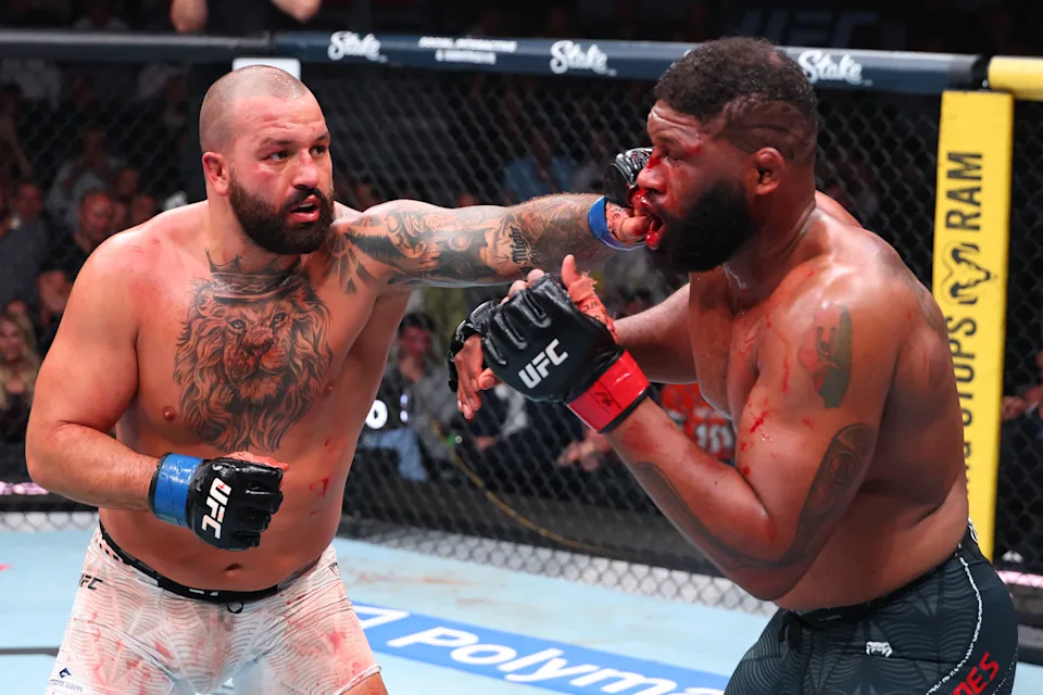 MIAMI, FLORIDA - APRIL 11: (L-R) Josh Hokit punches Curtis Blaydes in a heavyweight fight during the UFC 327 event at Kaseya Center on April 11, 2026 in Miami, Florida. (Photo by Ed Mulholland/Zuffa LLC)