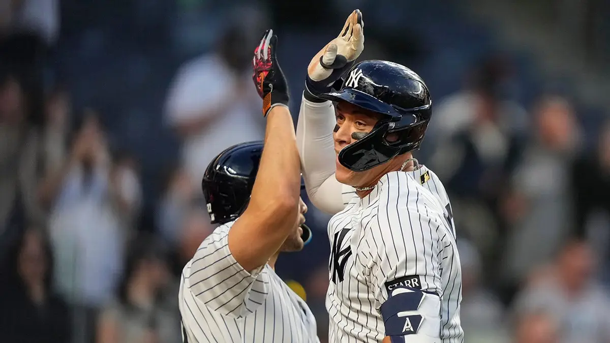 New York Yankees' Aaron Judge and Giancarlo Stanton celebrating on the field