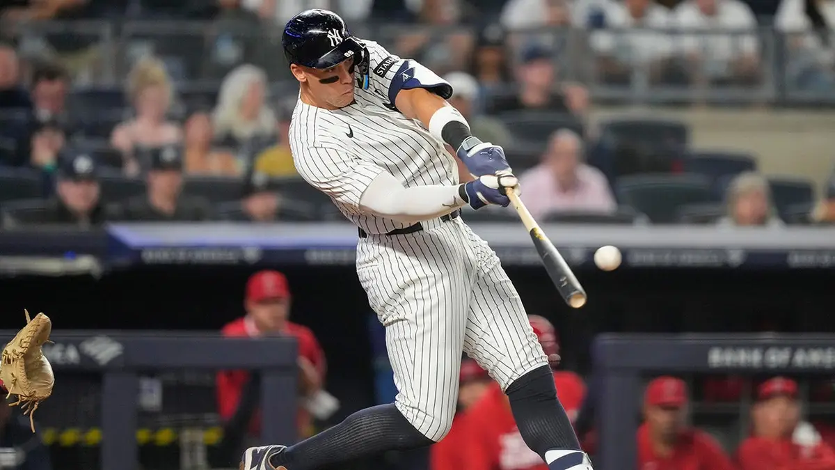 New York Yankees' Aaron Judge hitting a home run during a baseball game.