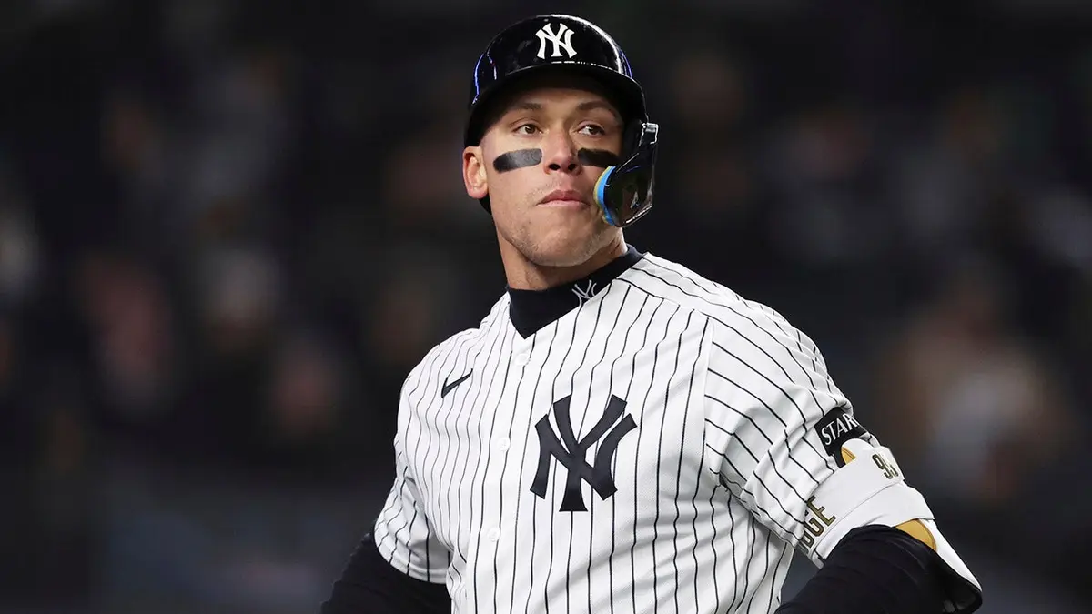 New York Yankees' Aaron Judge striking out during a baseball game.