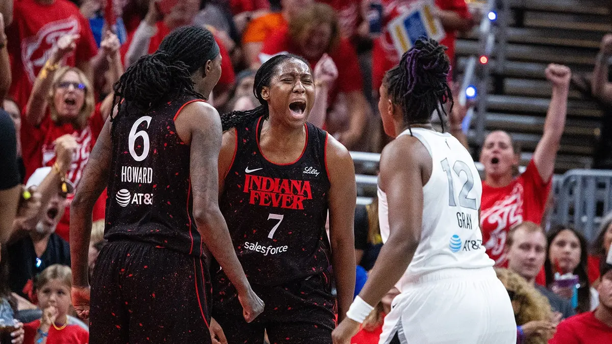 Indiana Fever forward Aliyah Boston celebrating after scoring during a basketball game.