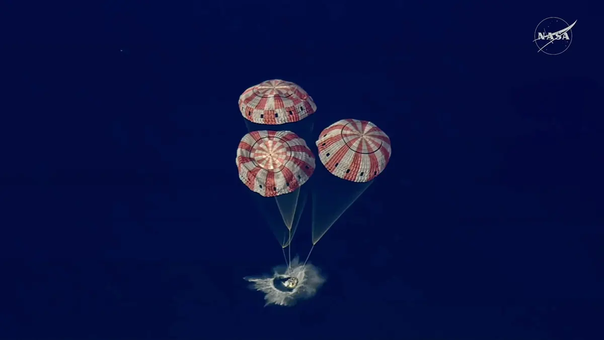 Artemis II Orion capsule splashing down in the Pacific Ocean