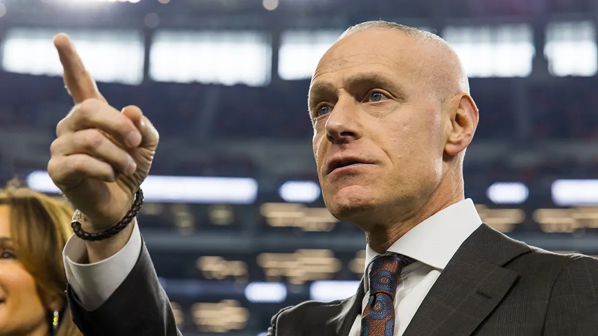 Big 12 Commissioner Brett Yormark gesturing at AT&T Stadium in Arlington, Texas.