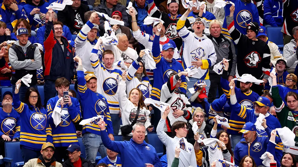 Buffalo Sabres fans celebrating during third period of NHL playoff game in Buffalo