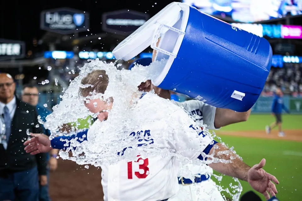 Max Muncy #13 of the Los Angeles Dodgers celebrates after an MLB game against the Texas Rangers at Dodger Stadium on April 10, 2026 in Los Angeles, California.