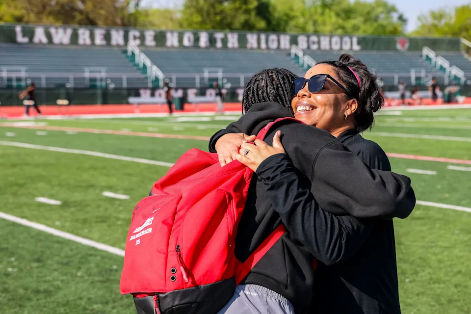 Lawrence North’s Tamika Beeler (right) hugs Jeremiah Hankerson Tuesday, May 6, 2025, before a high school track and field meet between Lawrence North and Lawrence Central at Lawrence North High School in Indianapolis.