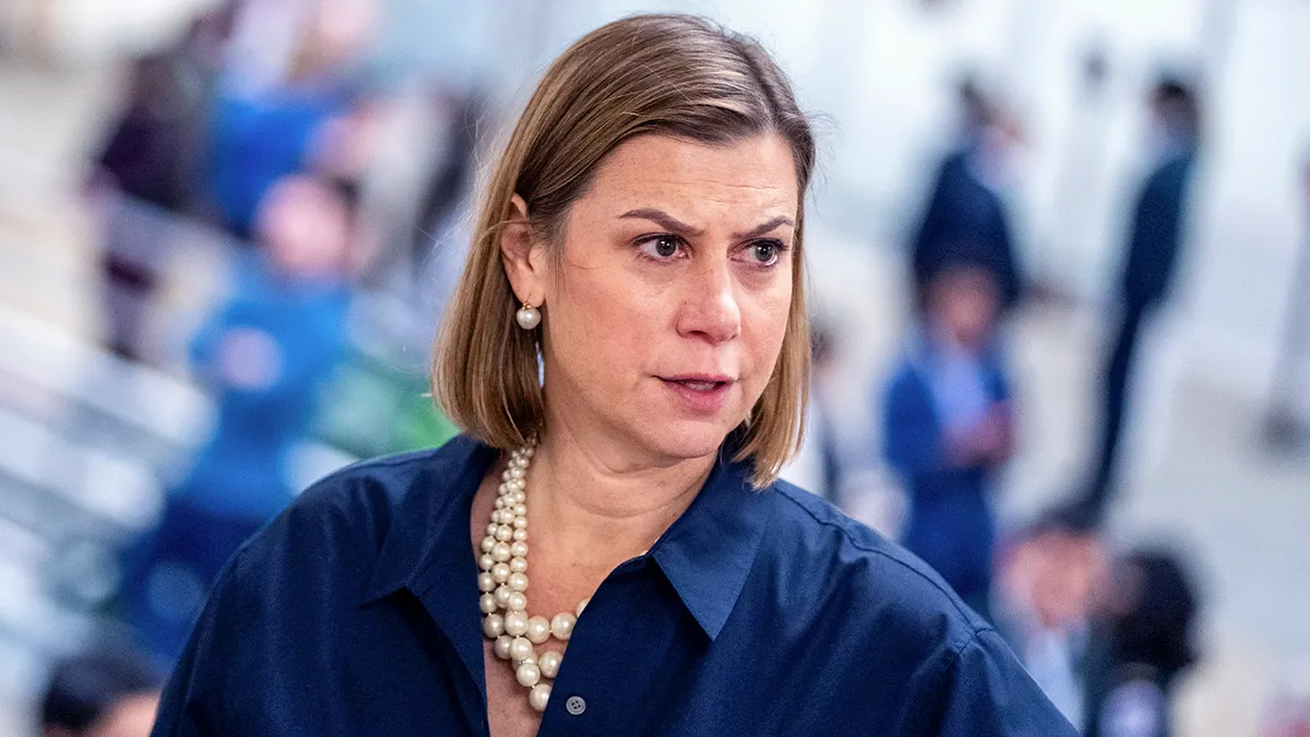Sen. Elissa Slotkin voting in the U.S. Capitol chamber