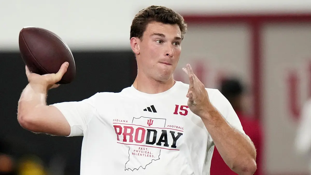 Indiana quarterback Fernando Mendoza looks to throw a pass during pro day.