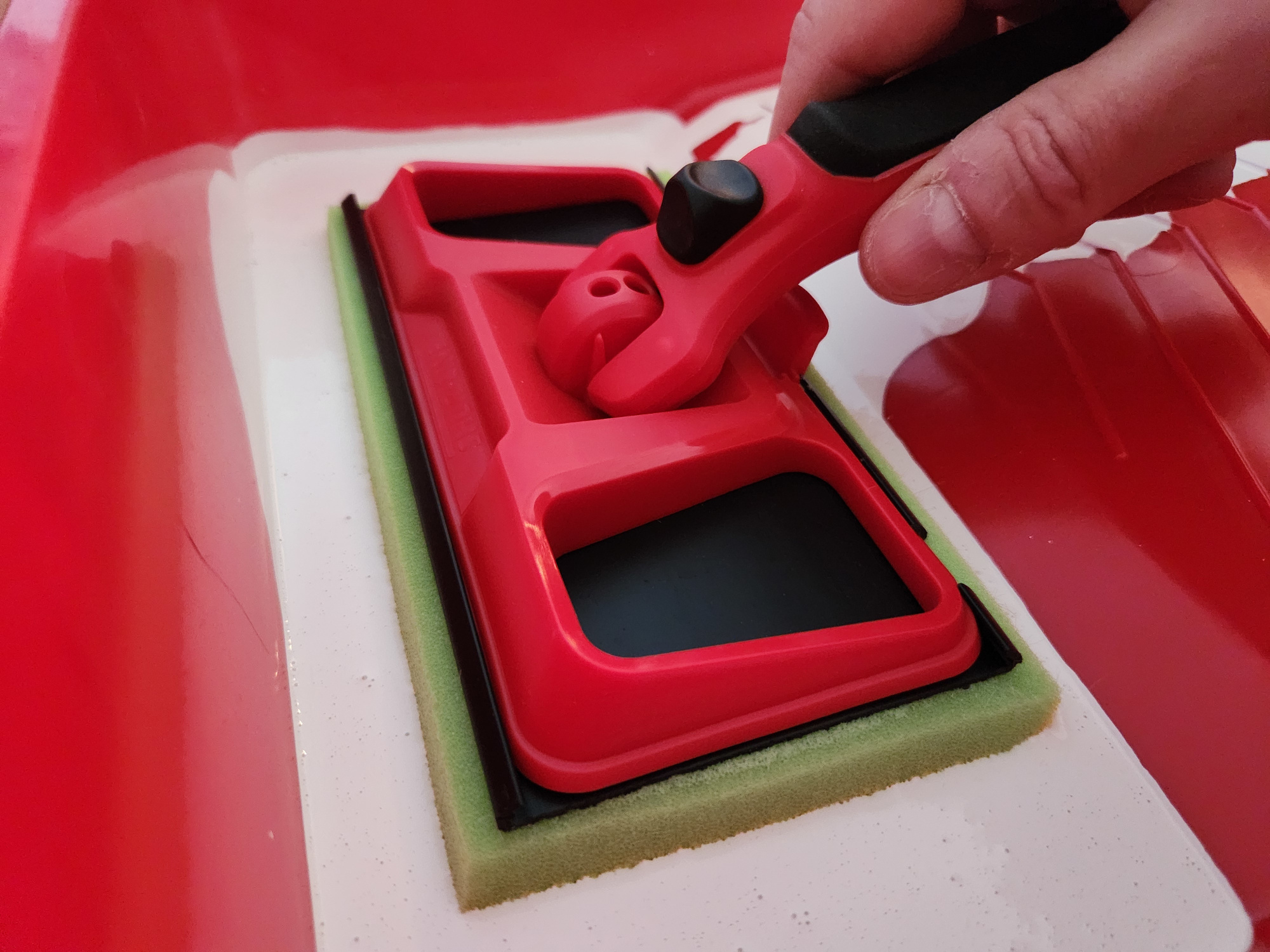 Loading up the paint pad.