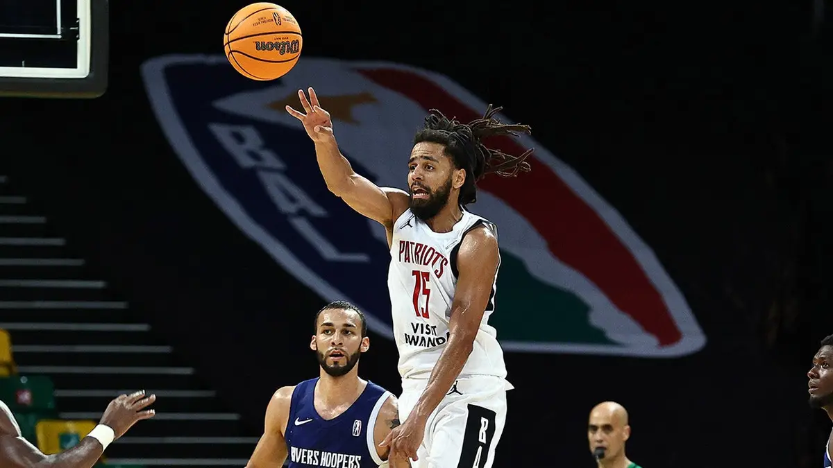 Jermaine Cole passing basketball during game at Kigali Arena