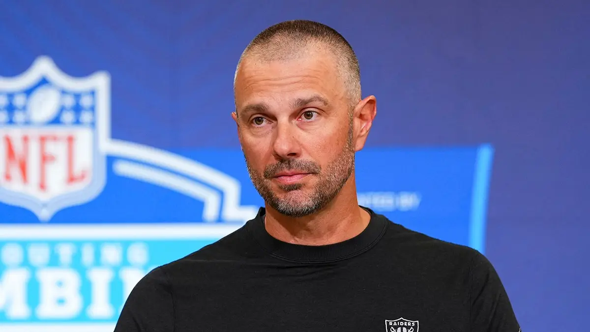 John Spytek speaking at a press conference at the NFL Scouting Combine in Indianapolis